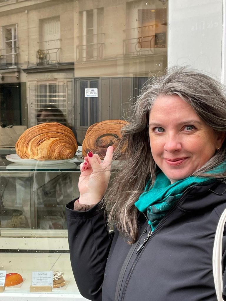 woman pointing at pastries